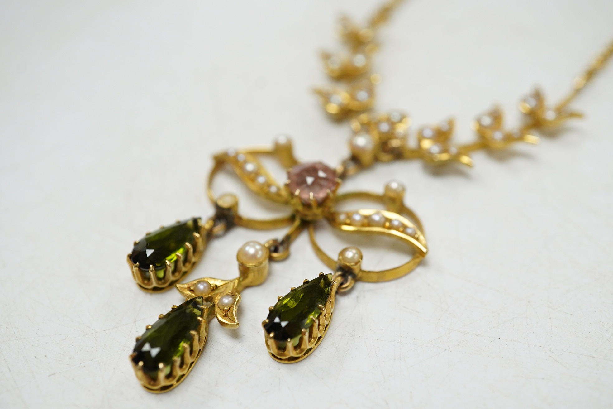 An early 20th century yellow metal and gem cluster set drop pendant necklace, 45cm, gross weight 12.7 grams. Condition - fair to good